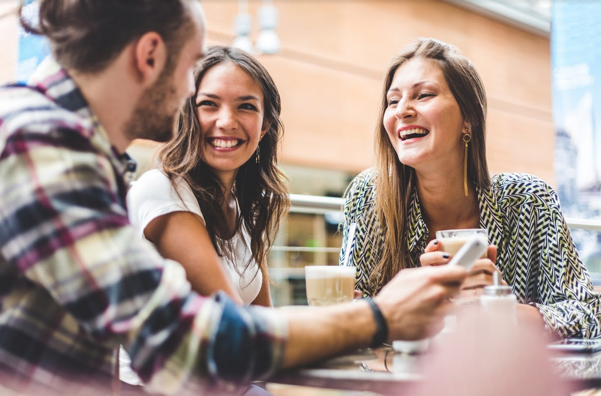 A group of friends talking and laughing together