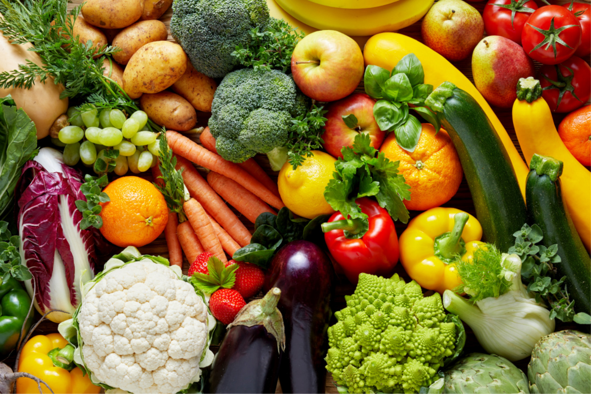 An array of fruit and vegetables. A healthy vegan diet can tackle obesity and support weight loss.