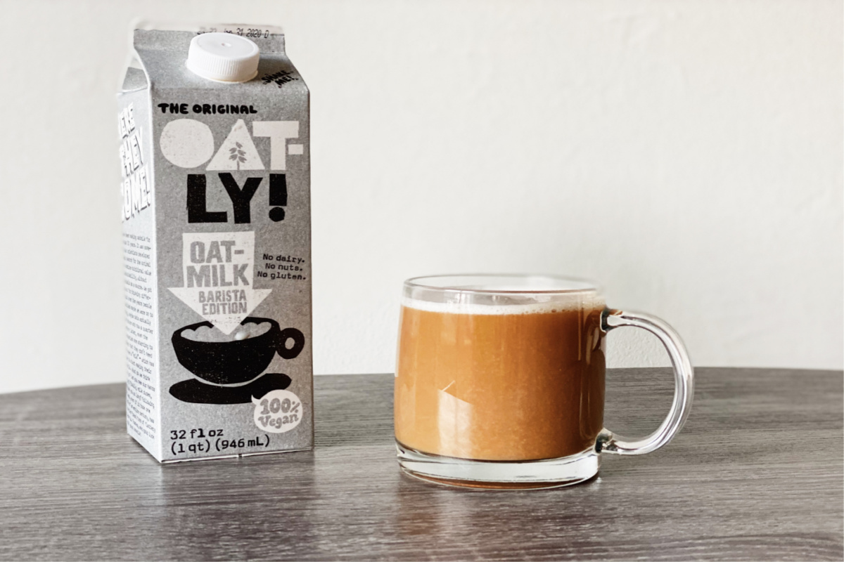 Oatly milk alongside a coffee