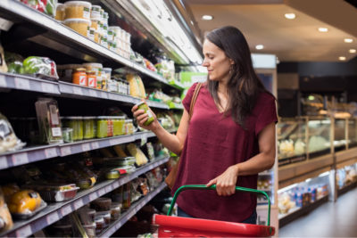 Young woman shopping in grocery store.