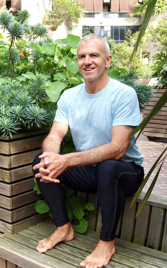 Morné, Veganuary participant, sitting outside. His cholesterol levels have been healthy after going vegan. 