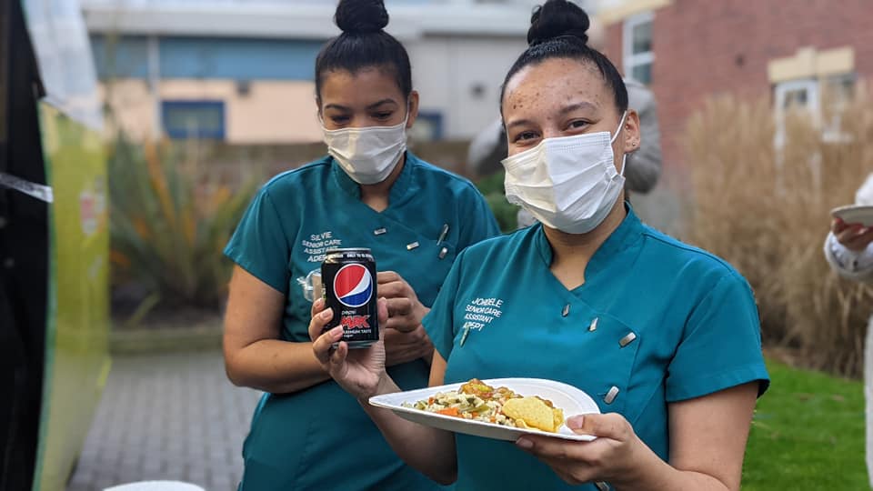Staff at Adept Care Homes trying vegan food