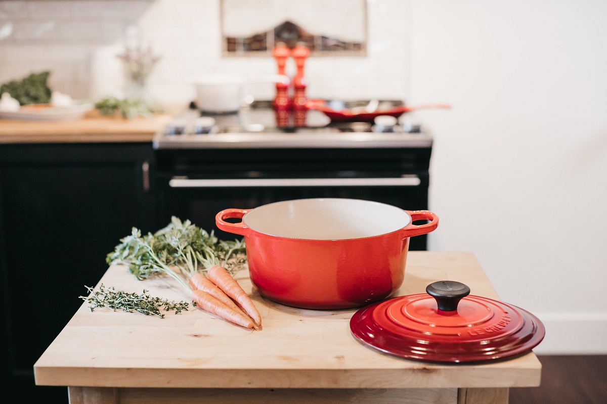 Dish and carrots on kitchen worktop