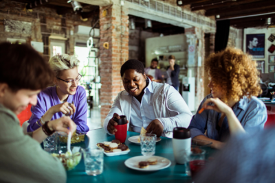 Colleagues eating vegan lunch
