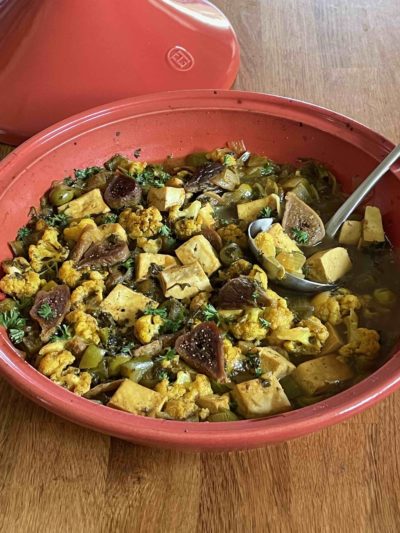 A tagine full of vegan cauliflower tofu tagine with figs