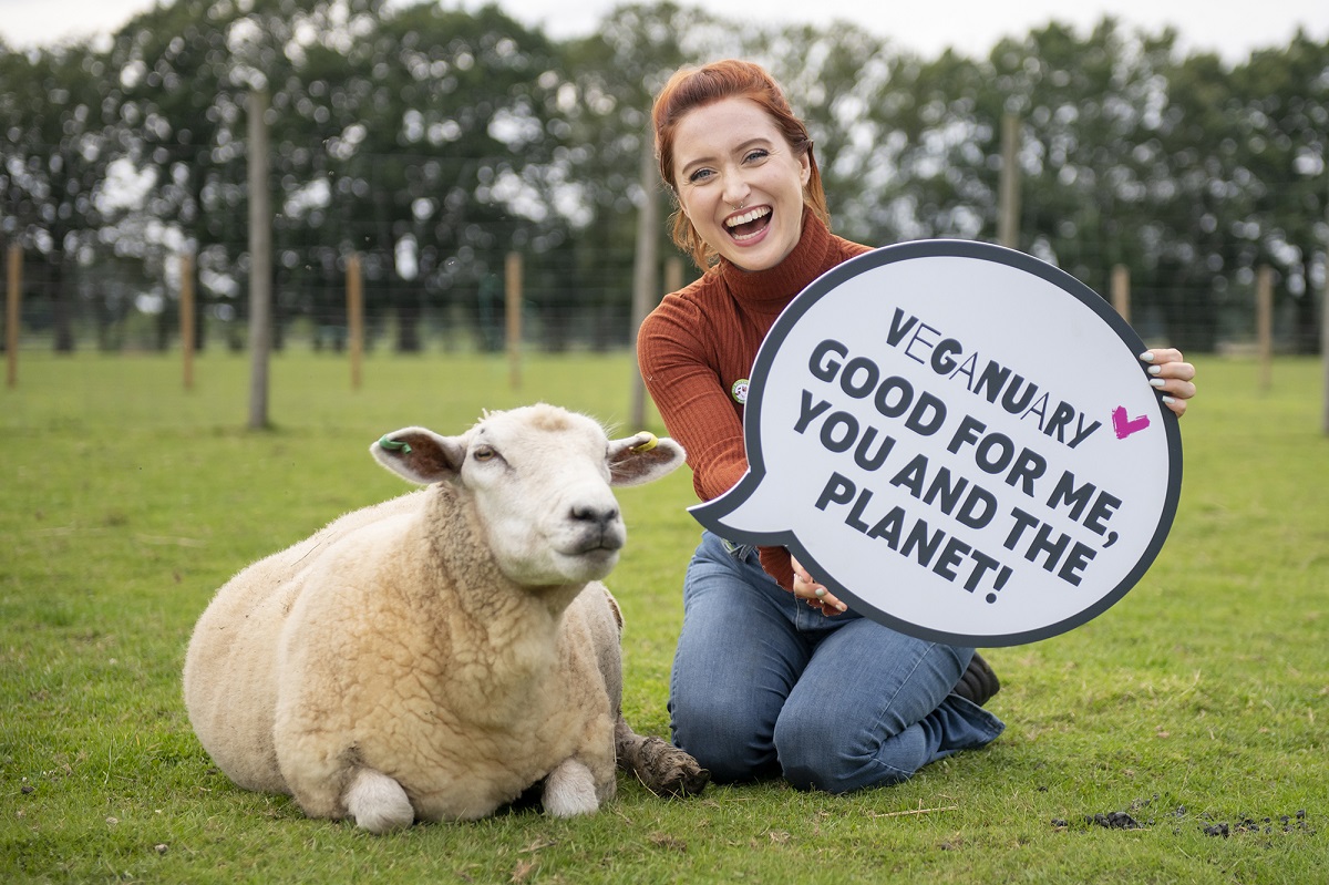 Eva O' Hara with a sheep