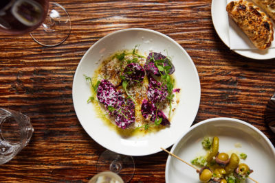 A white dish holds a fresh remolachas