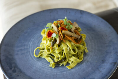 Tagliatelle Pasta with Sautéed Mushrooms and Wakame Pesto on a plate