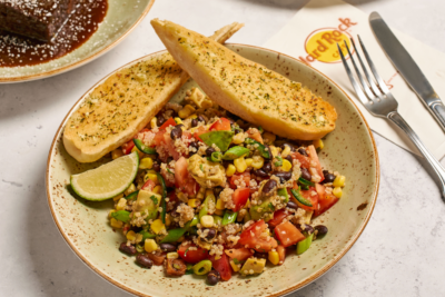 Photo of a tofu scramble with toast next to a Hard Rock Cafe menu